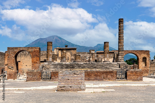 Ancient walls of Pompeii with Vesuvius volcano, archaeological site in the Campania region of southern Italy with exposed ruins.