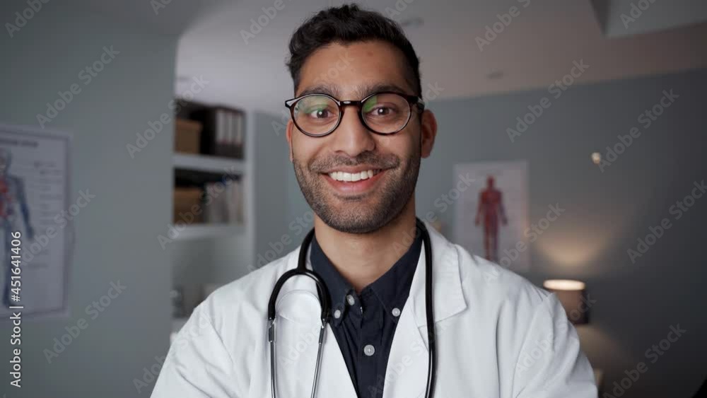 Mixed race male doctor standing in office wearing stethoscope Mixed race male doctor standing in office wearing stethoscope
