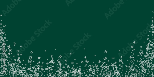 Falling letters of English language. Chalk handdrawn flying words of Latin alphabet. Foreign languages study concept. Fabulous back to school banner on blackboard background.