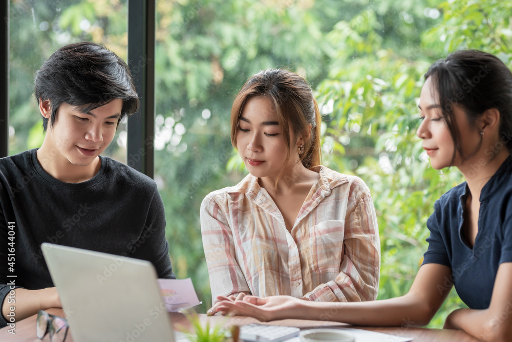 Team of business people sitting in a brainstorming meeting analyzing work together at the office. Team of business people sitting in a brainstorming meeting analyzing work together at the office.