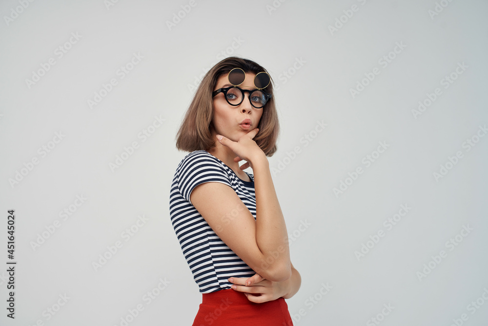 woman wearing fashion glasses striped t-shirt light background glamor woman wearing fashion glasses striped t-shirt light background glamor
