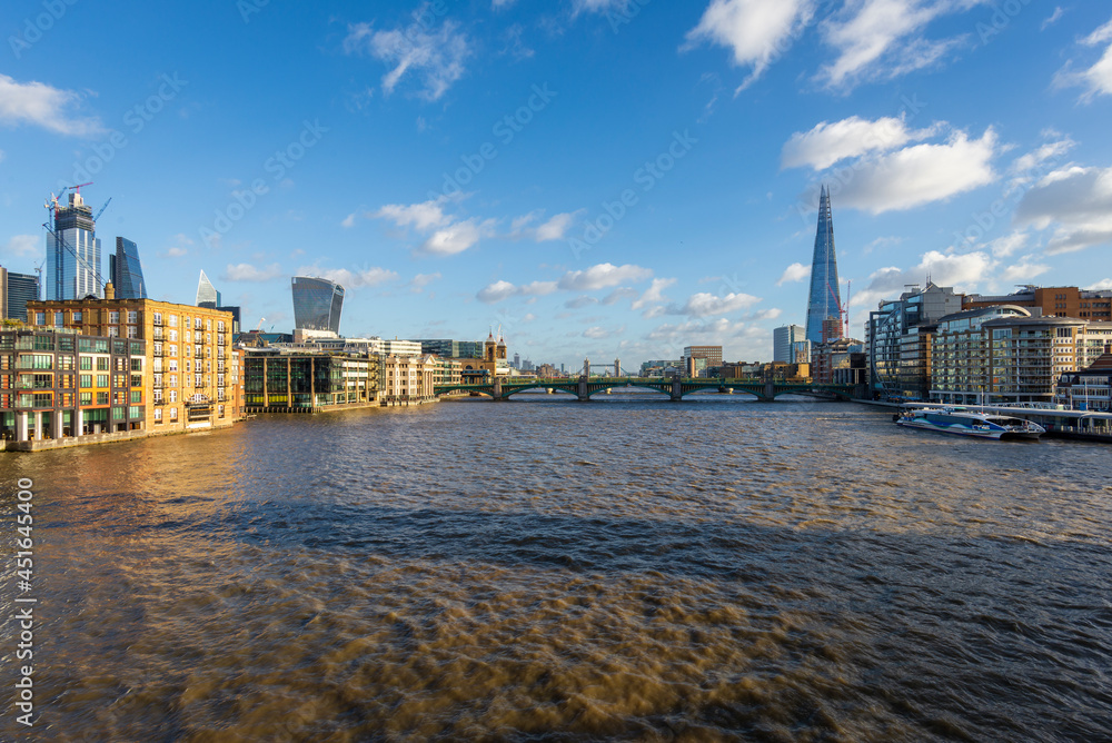 The Thames river viewed from a bridge on sunset time in London, UK