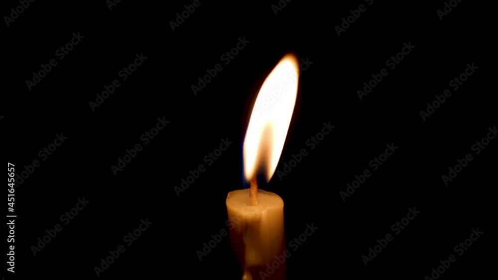Close-up of the flame burning on the candle with isolated on a black background. Candle flame in the dark.
Close-up of the flame burning on the candle with isolated on a black background. Candle flame in the dark.