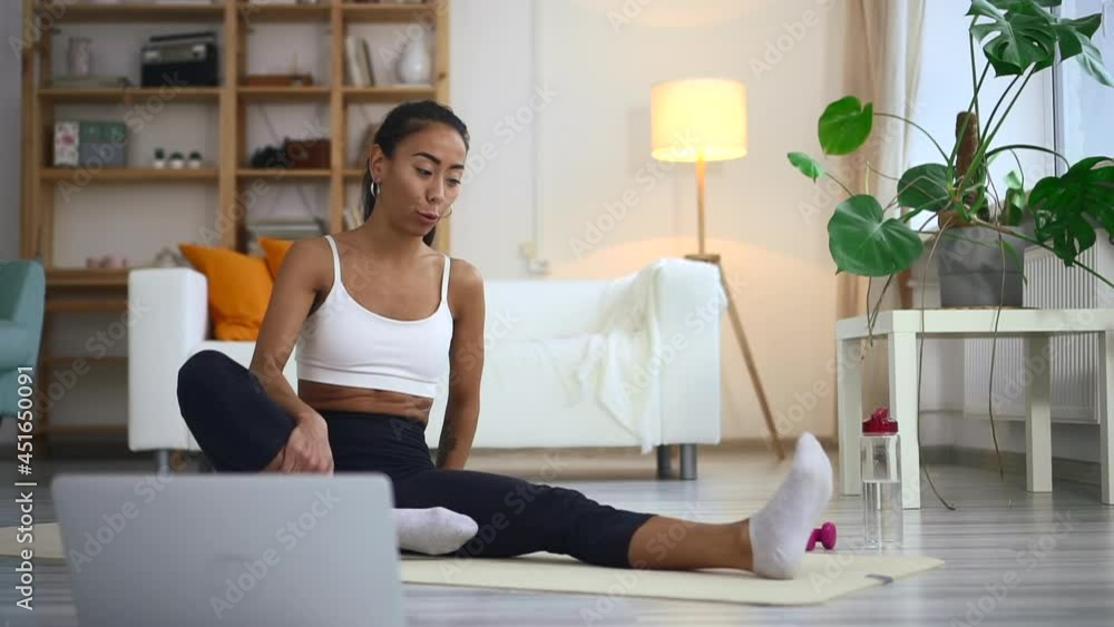 Fitness trainer gives online lesson showing exercise at home Fitness trainer gives online lesson showing exercise at home
