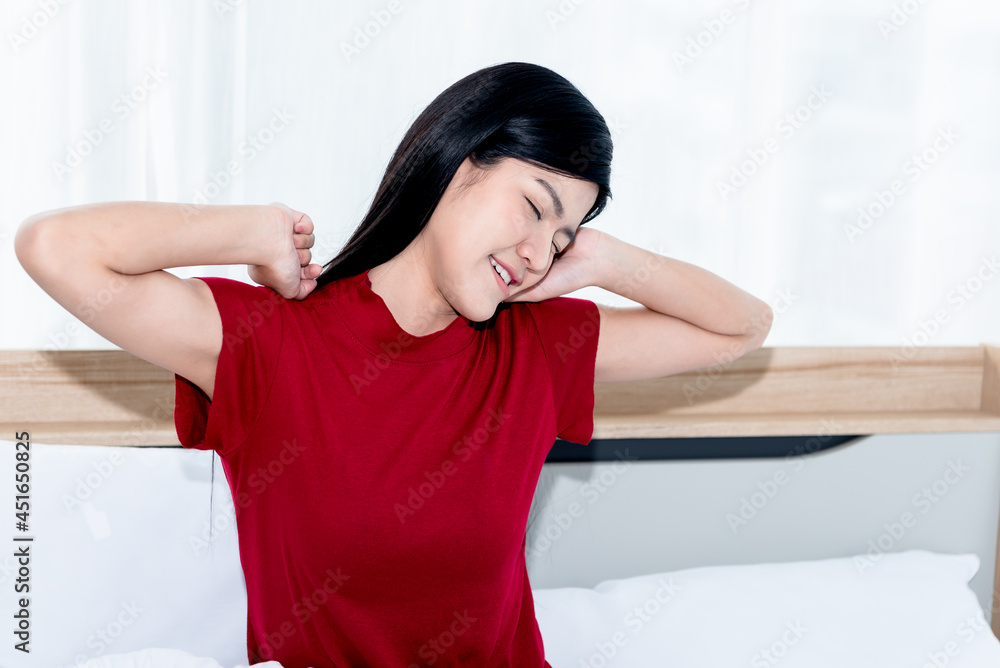 Asian attractive woman waking up With freshness and happiness Because she got a good night's sleep on a clean and white bed in her bedroom, to people and healthy concept. Asian attractive woman waking up With freshness and happiness Because she got a good night's sleep on a clean and white bed in her bedroom, to people and healthy concept.