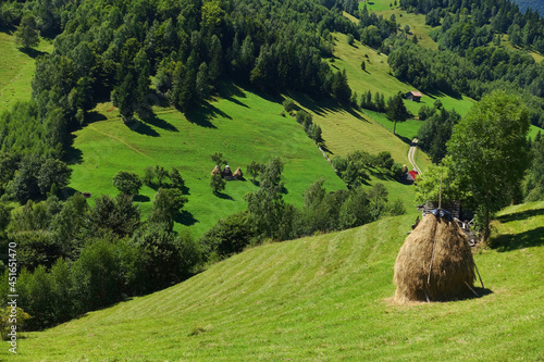 Summer landscape in the Carpathians, Magura Village, Romania, Europe photo