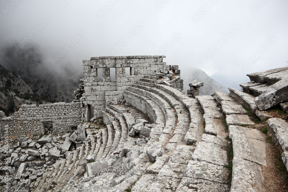 scenic amazing picturesque view to ancient theatre of Termessos , Turkey in the low clouds