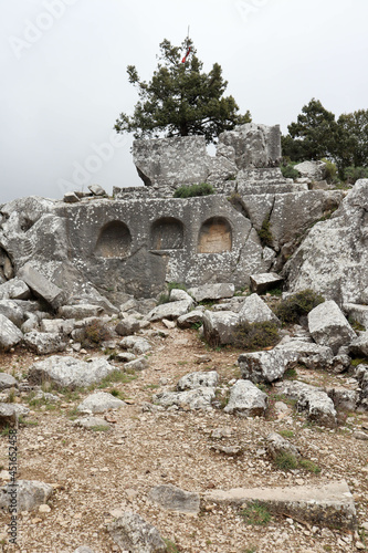 Heroon ancient tombs in abandoned city Termessos in Turkey mountains photo