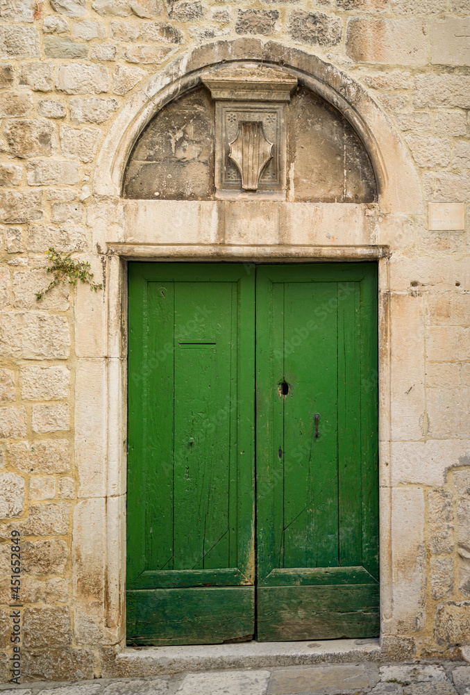 old wooden door in a wall