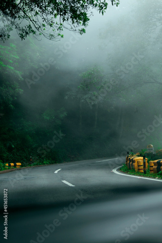 Foggy morning in nainital uttarakhand, beautiful road view of mountains in uttarakhand india