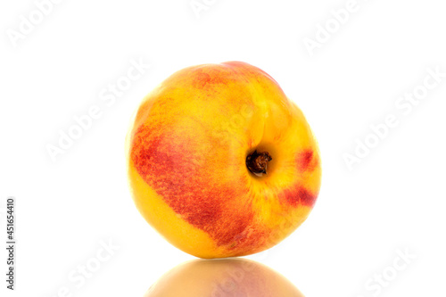 One juicy ripe nectarine, close-up, isolated on white.