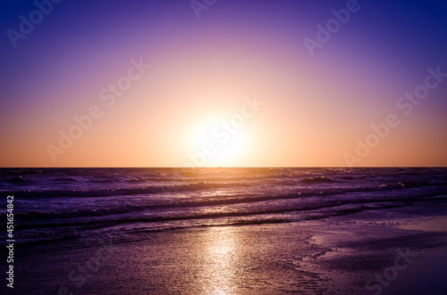 sunset over the ocean © Javier