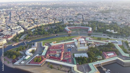 Aerial footage over the center of Saint-Petersburg Russia, drone flight during sunrise, Petropavlovskaya tower and Neva river 4K photo