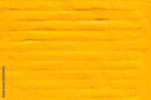 texture of a wall with yellow paint