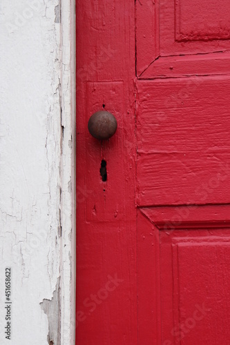 Old Weathered Door, Red, White Wall With Peeling Pai