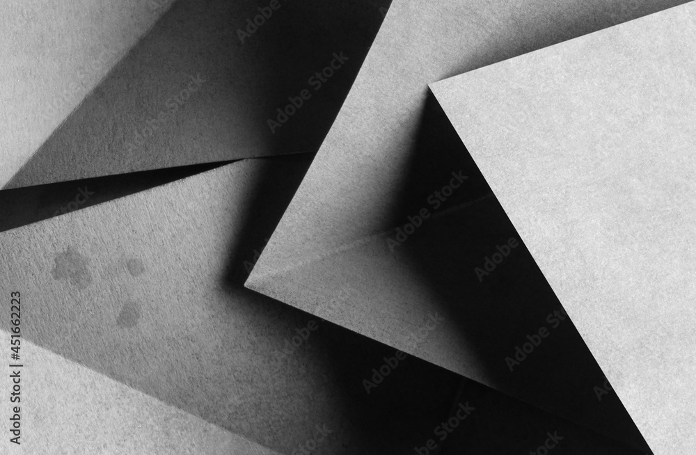 Geometric shapes made paper, dark background Geometric shapes made paper, dark background
