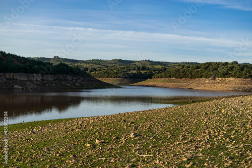 Guadalen reservoir at sunset and at half its capacity. Photograph taken in Jaen, Andalucia, Spain. 