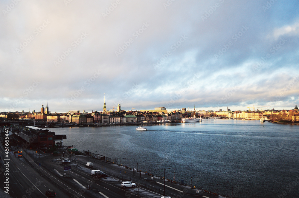 STOCKHOLM, SWEDEN: Scenic cityscape view of old city center Gamla Stan with colorful buildings near the water STOCKHOLM, SWEDEN: Scenic cityscape view of old city center Gamla Stan with colorful buildings near the water
