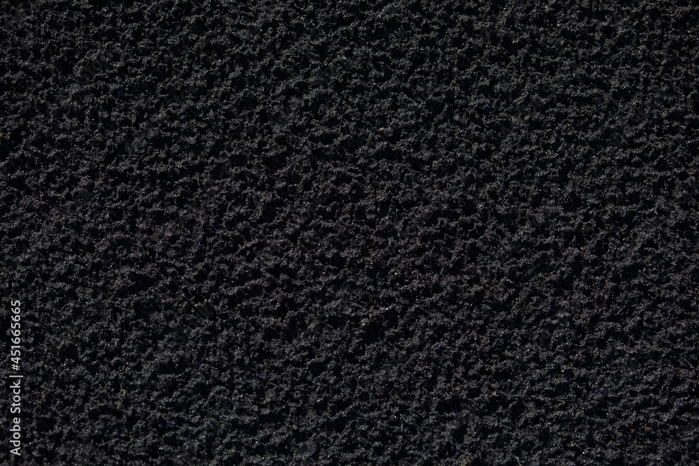 Fototapeta premium natural texture of black sand close-up