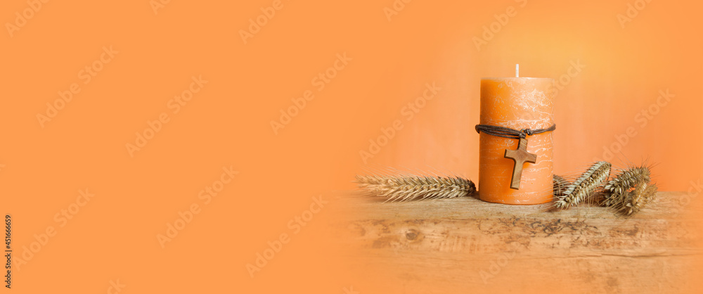 Candle with wooden cross and grain - greeting card and background for confirmation, communion, baptism Candle with wooden cross and grain - greeting card and background for confirmation, communion, baptism