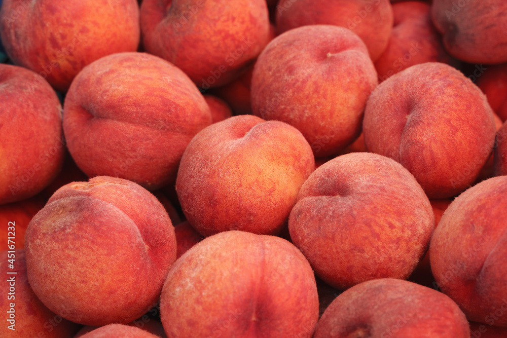 Organic peaches on the market. Background, food texture, new harvest. Organic peaches on the market. Background, food texture, new harvest.