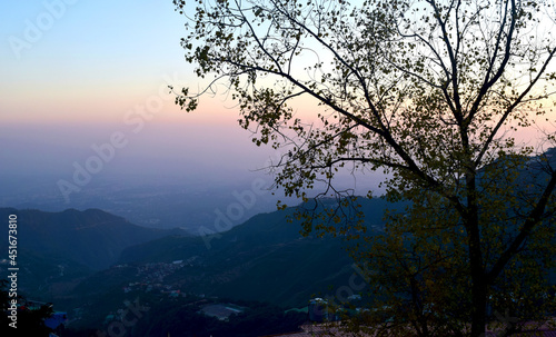 A picture of the Scenic beauty of the Valley, Mountains, and trees, from a high point in Mussoorie, Uttarakhand.