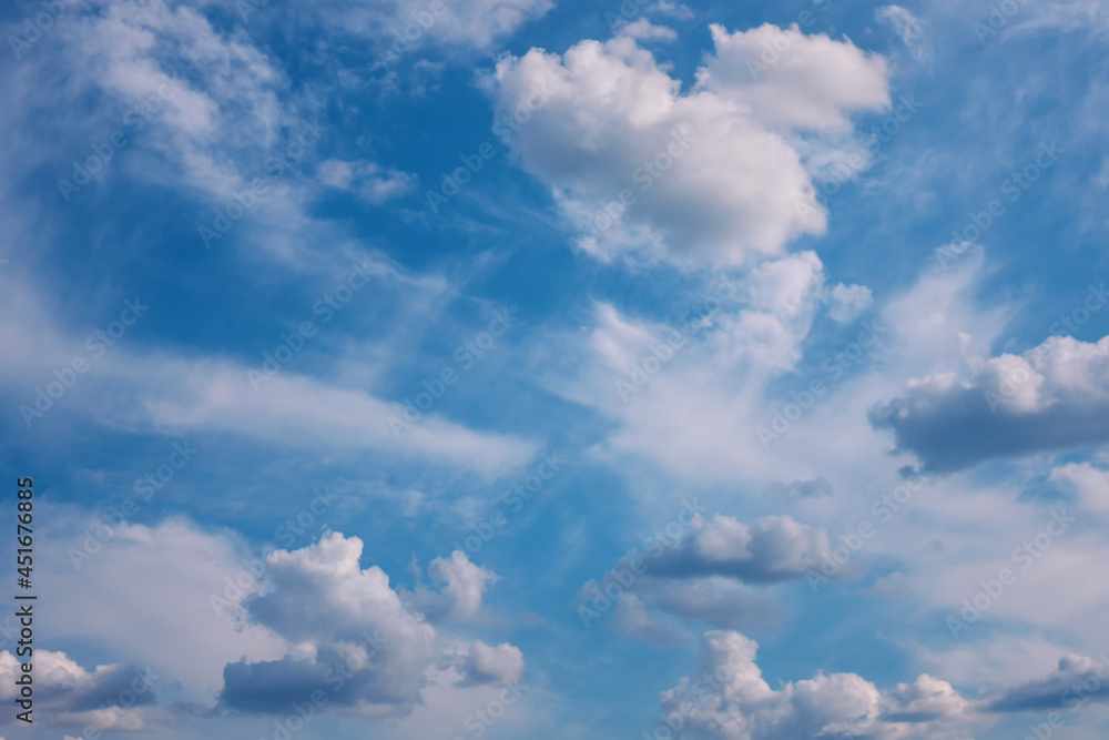 Fototapeta premium Blue sky with white clouds. Bright air background at sunny day.