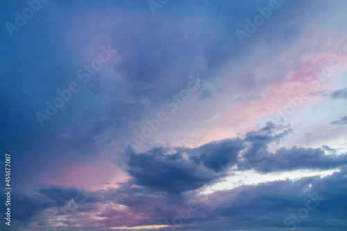 Colorful morning sky with clouds in soft pastel colours. Beautiful natural view of free space. Lovely sunrise background for energy boost and motivation.