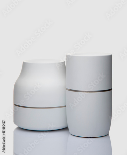 White plastic ashtrays on white background