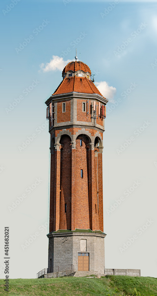 Fototapeta premium Old Water Tower On Blue Clear Sky
