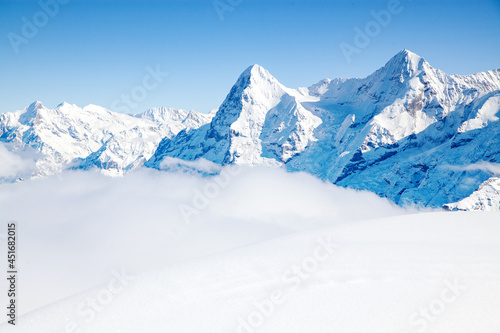 white winter background with snowy peaks in the Swiss Alps © Melinda Nagy