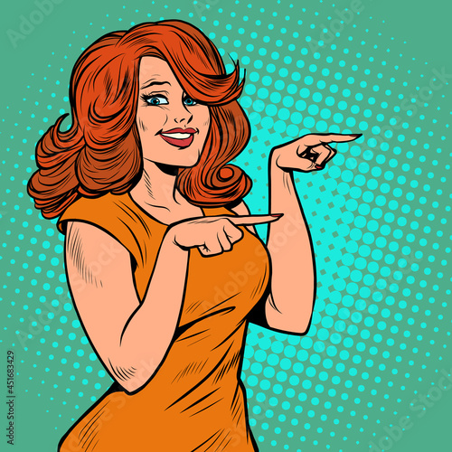 The woman points with her finger. A presentation gesture. Beautiful girl