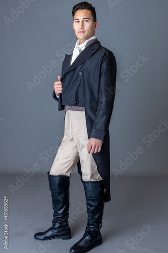 Fotografía A Regency gentleman standing against a studio backdrop