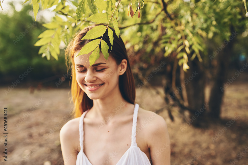 pretty woman near tree green leaves glamor home close-up pretty woman near tree green leaves glamor home close-up