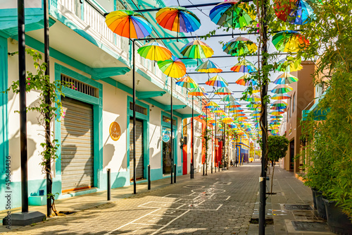 Popular attraction alley in the downtown of Puerto Plata, Dominican Republic, decorated with colorful umbrellas