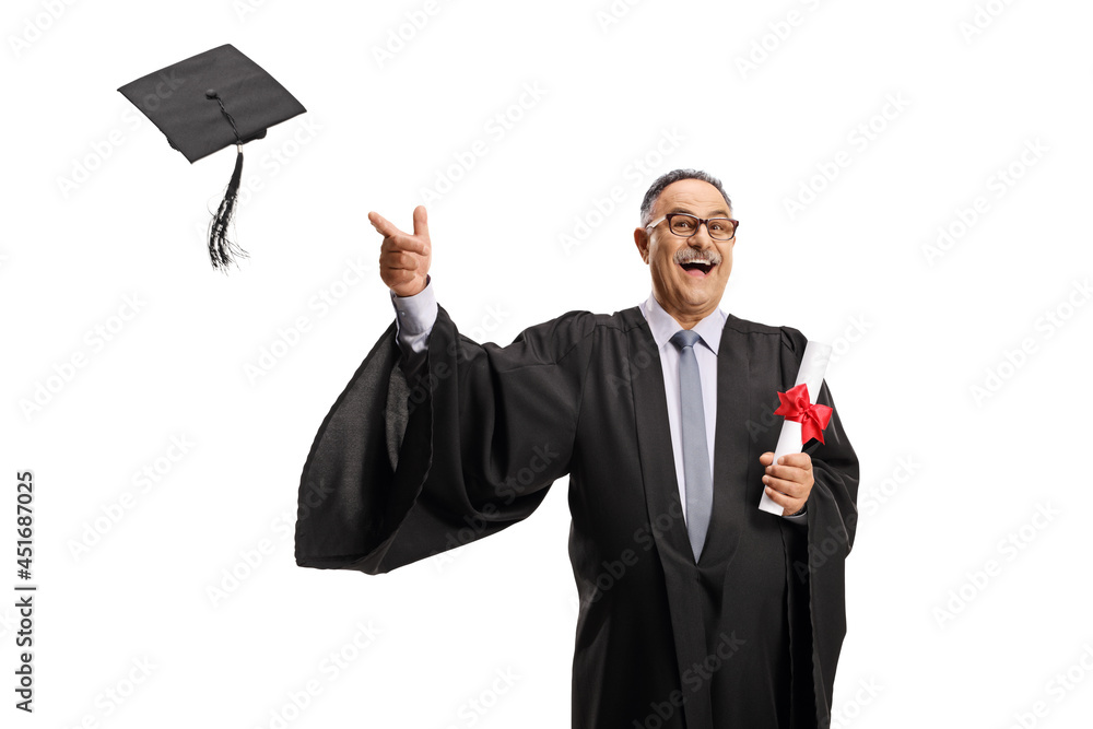 Happy mature man in a graduation gown holding a diploma and throwing hat Happy mature man in a graduation gown holding a diploma and throwing hat
