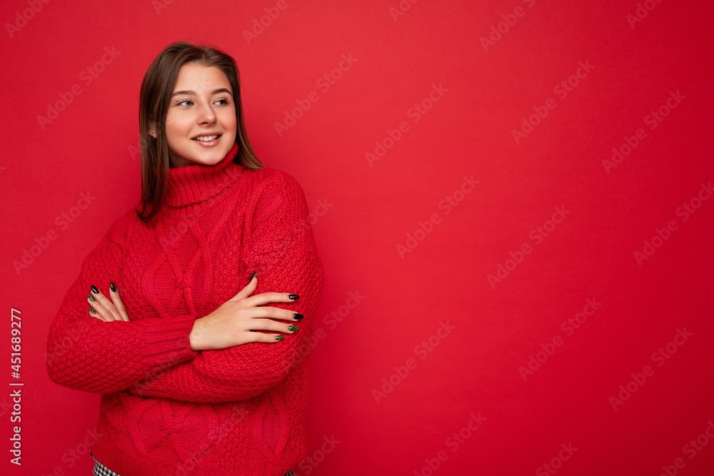 Shot of attractive happy smiling young woman wearing casual outfit standing isolated over colourful background with empty space looking to the side Shot of attractive happy smiling young woman wearing casual outfit standing isolated over colourful background with empty space looking to the side