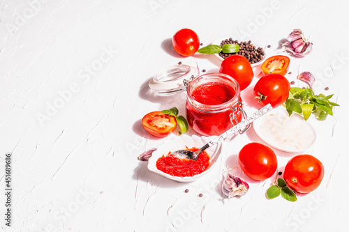 Tomato confiture, jam, chutney, sauce in a glass jar