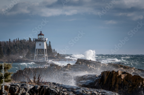 Waves crashing at lighthouse in northern Minnesota