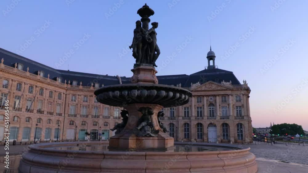 Fountain of the three graces at Place de la bourse in Bordeaux during sunrise with nobody Fountain of the three graces at Place de la bourse in Bordeaux during sunrise with nobody