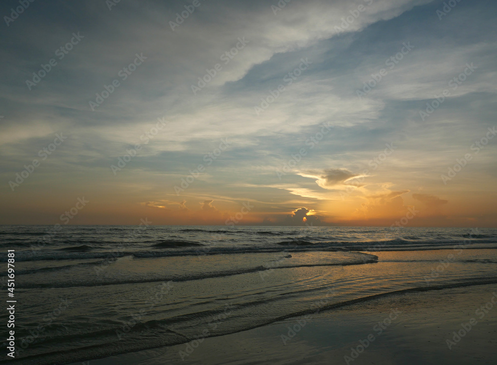 Calm evening tides and big sky on coast
