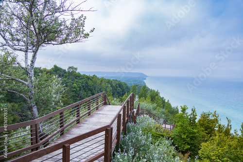 Wooden staircase down the side of a hill with Lake Michigan in background