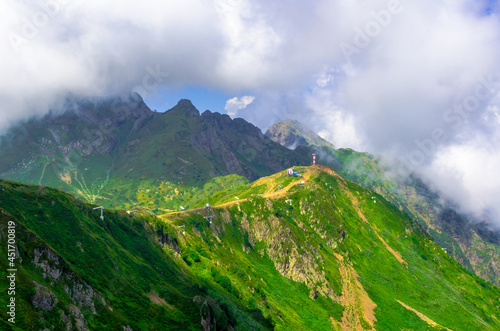 Fototapeta Naklejka Na Ścianę i Meble -  Beautiful Summer sunny mountains with clouds and meadow