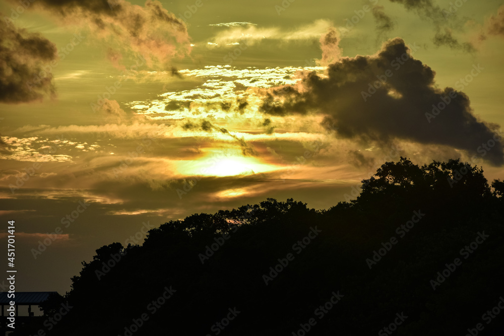Glowing sunset through clouds in Sanibel Glowing sunset through clouds in Sanibel