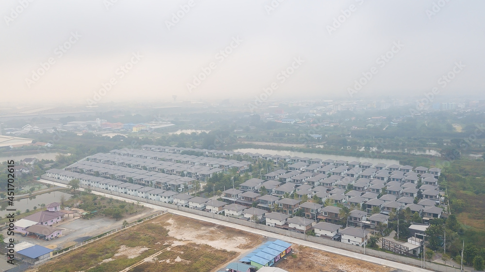 bad air with PM 2.5 dust in the atmosphere  in the city,blurred sky dark with air pollution smoke cloud dust mist for background, problem in atmosphere sky environment, toxic pollution in atmosphere s