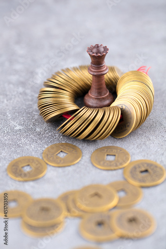 Chess pieces surrounded by coins