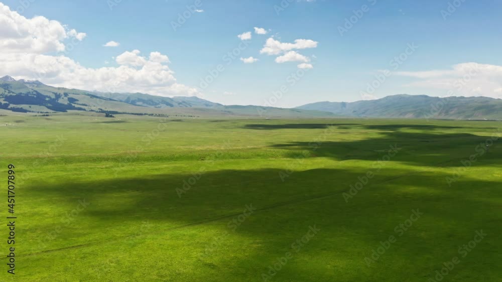 Vast grasslands and mountains in a fine day. Vast grasslands and mountains in a fine day.