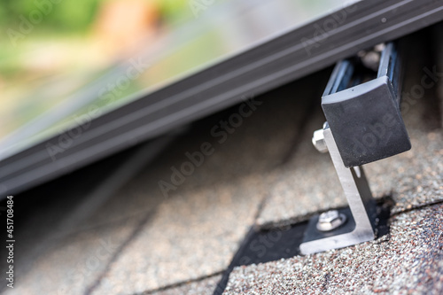 Rail, bracket, and anchor to a solar panel installed on a asphalt shingle roof