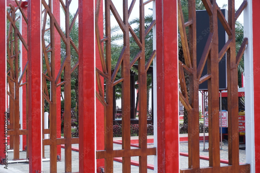 Modern red fence with a natural background Modern red fence with a natural background
