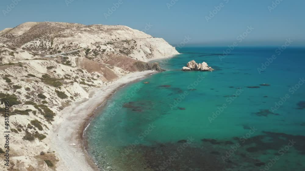 Beautiful blue lagoon panorama. Cyprus island. Azure ocean water. Famous tourist destination. Clear coast, white rocks, road in hills, blue sky, green bushes. Amazing nature landscape. Drone flight Beautiful blue lagoon panorama. Cyprus island. Azure ocean water. Famous tourist destination. Clear coast, white rocks, road in hills, blue sky, green bushes. Amazing nature landscape. Drone flight
